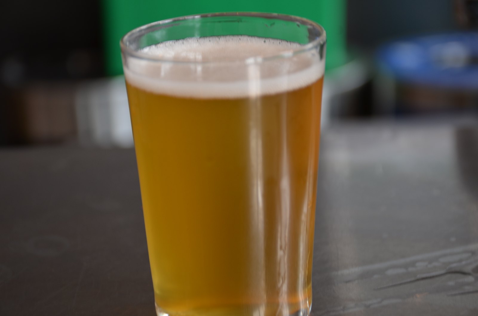 Hazy golden IPA in a pint glass